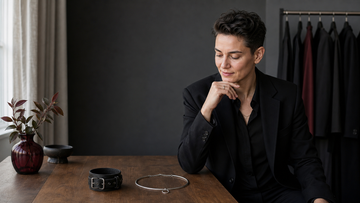 Adult choosing between two alternative accessories to represent flexible BDSM roles