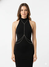 Silver-tone Y-shaped halter body chain with waist drapes over a black dress, front view
