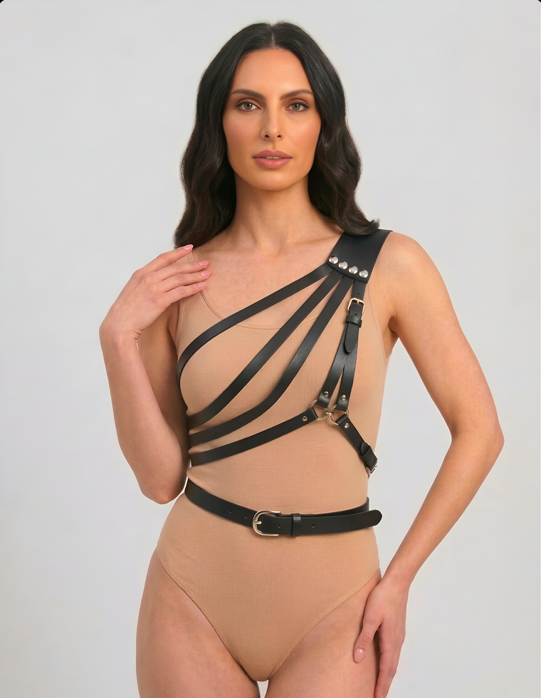 Black asymmetric one-shoulder harness with layered chest straps, front view