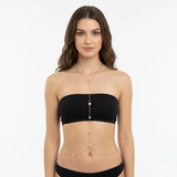 Minimal gold-tone pearl-look body chain in a Y shape from neckline to waist, front view