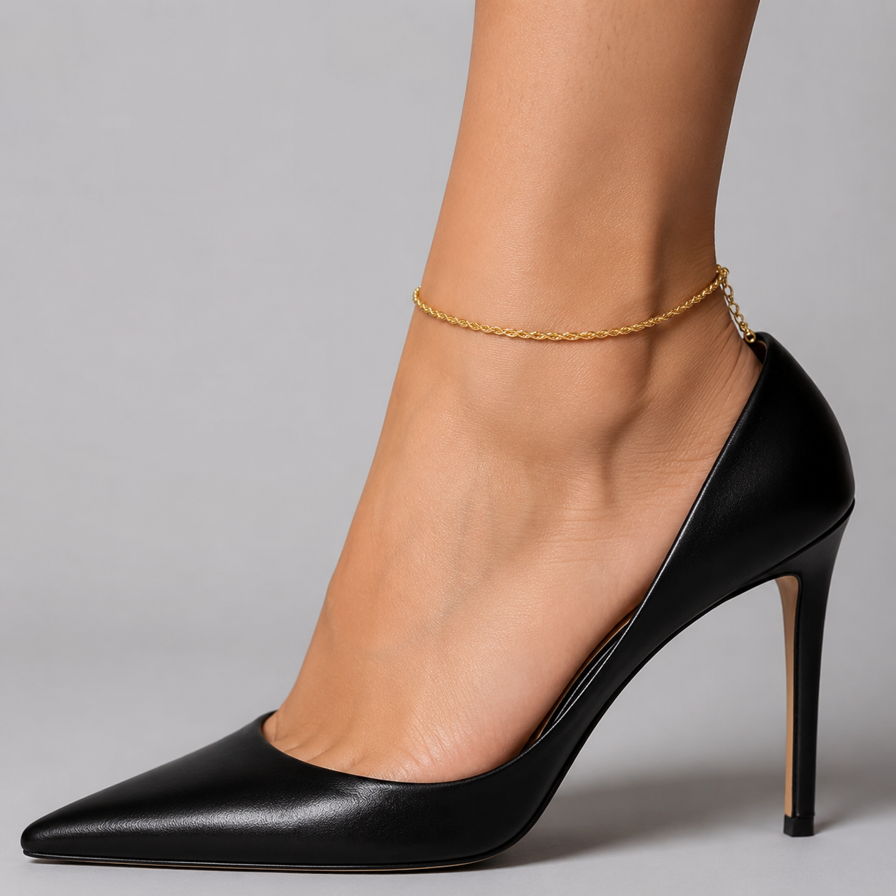 Gold rope chain anklet - fine twisted gold rope chain on the ankle with black pointed heels