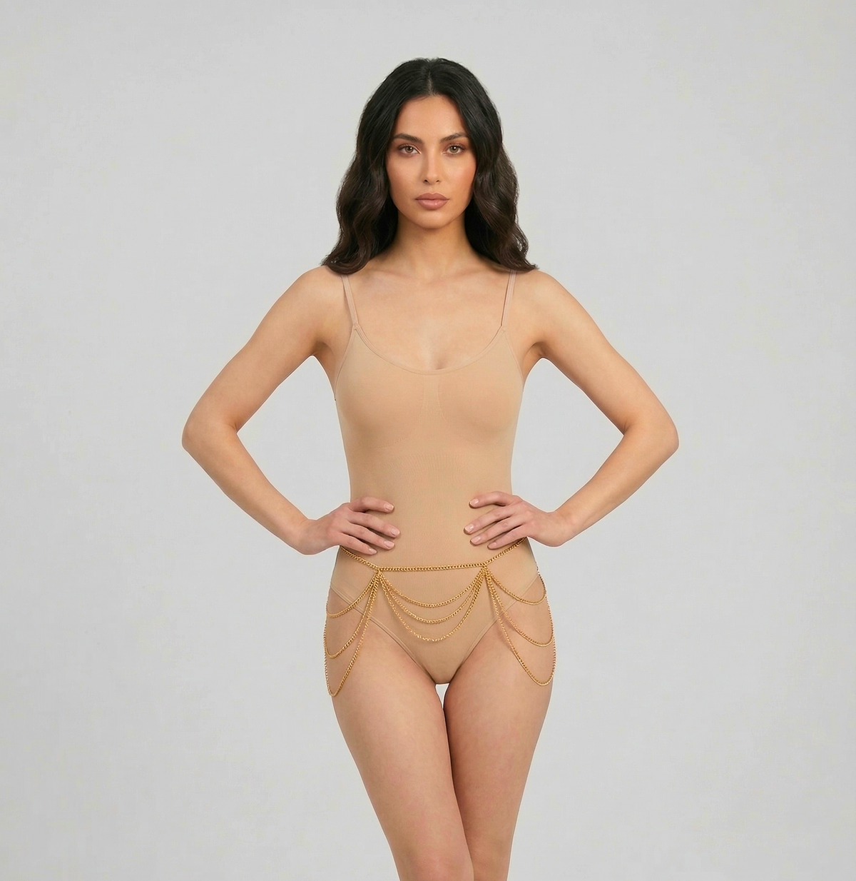 Gold-tone layered belly chain with draped waist and hip lines, front view