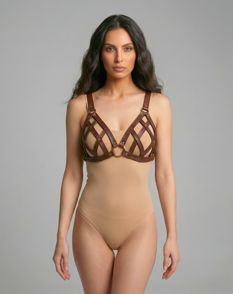 Breast frame harness front view with open black faux leather chest straps