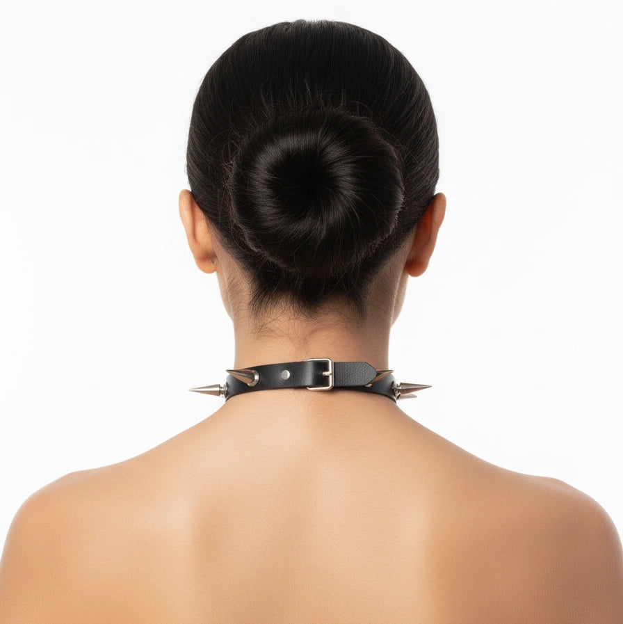 Black studded punk collar showing the rear closure and spike placement, back view