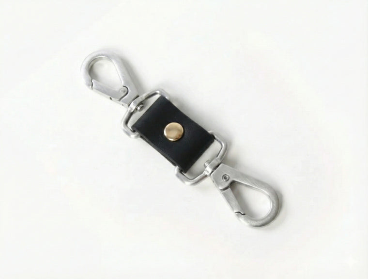 Silver-tone double-ended swivel snap connector for harnesses and cuffs