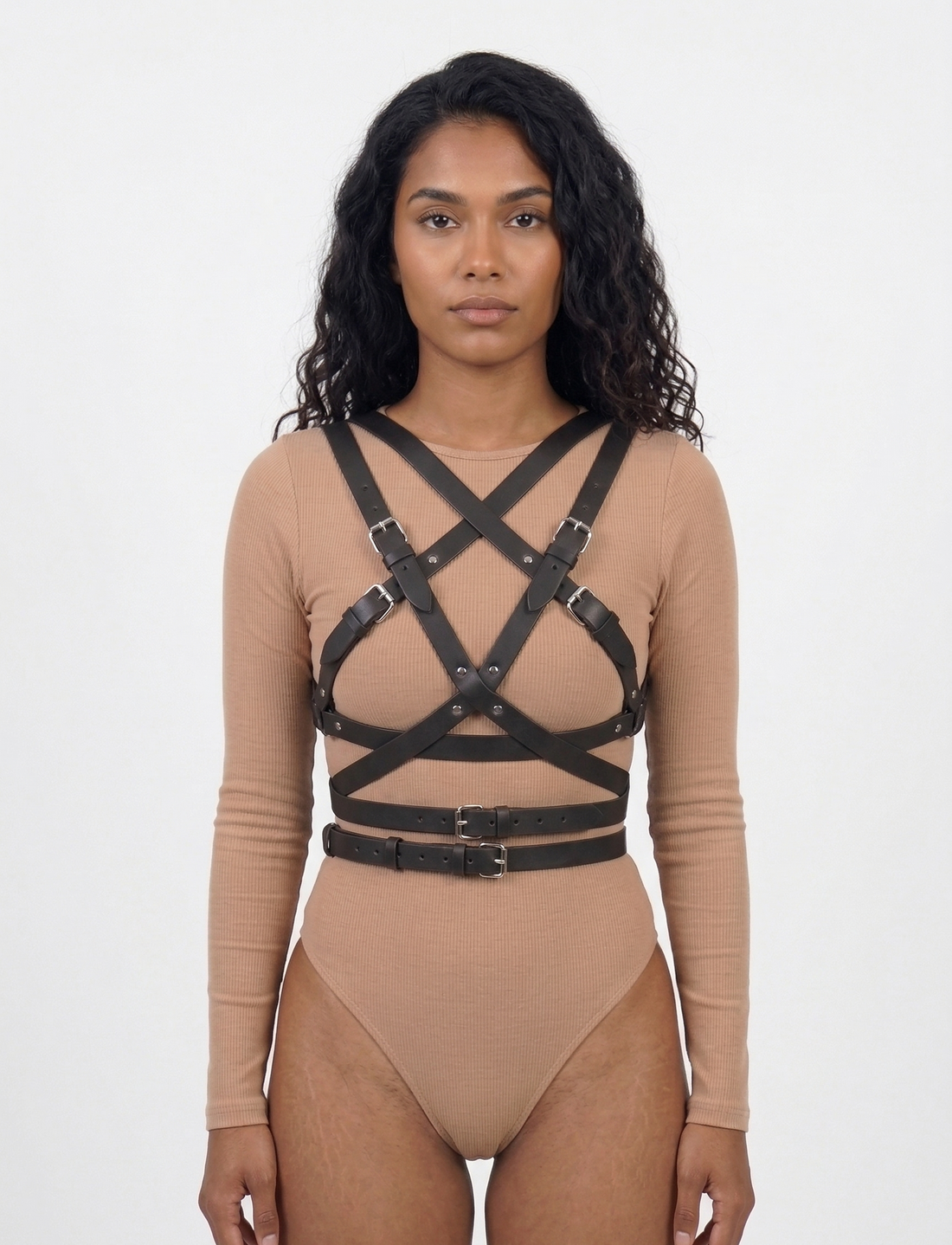 Wrap harness front view - black leather cross-body X-strap design with double waist belt and buckle closures