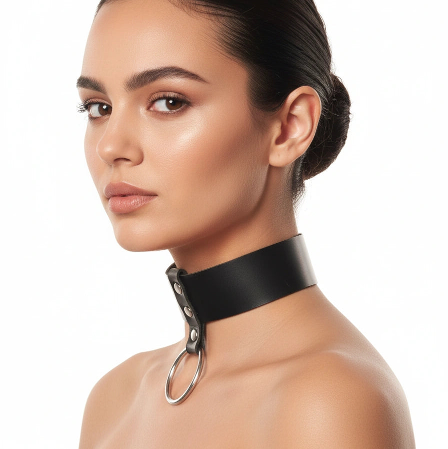 Bondage collar and leash set detail showing the black band, O-ring and chain clip