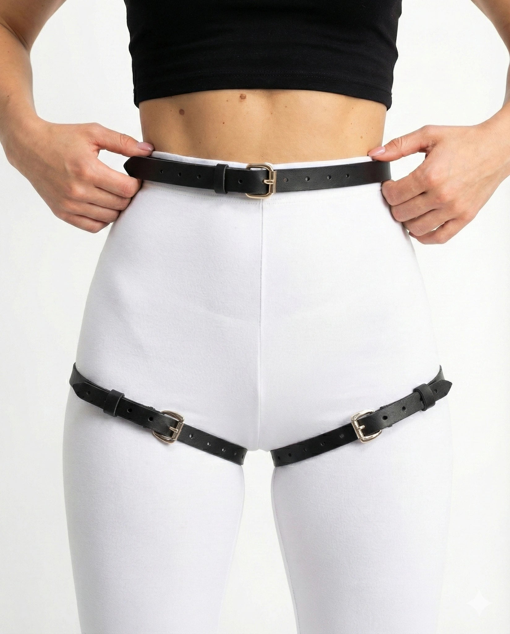 Black faux leather waist belt with two detachable thigh straps, front close-up