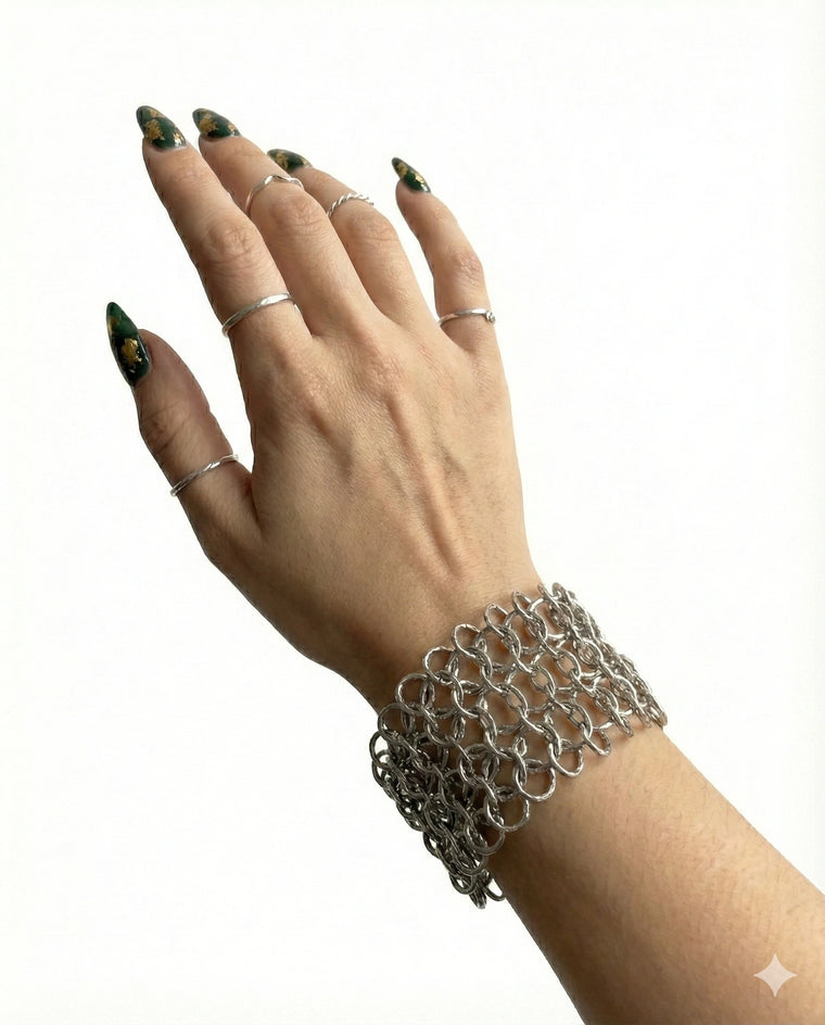 Wide gold-tone chainmail cuff bracelet front view with layered metal mesh
