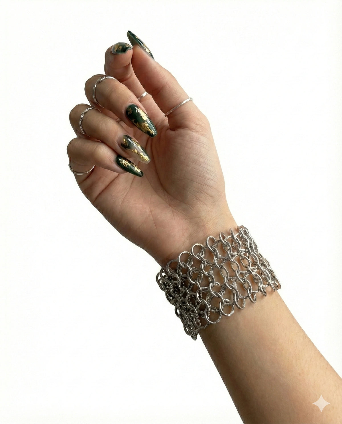 Wide chainmail cuff angle view showing the warm bronze-tone metal mesh